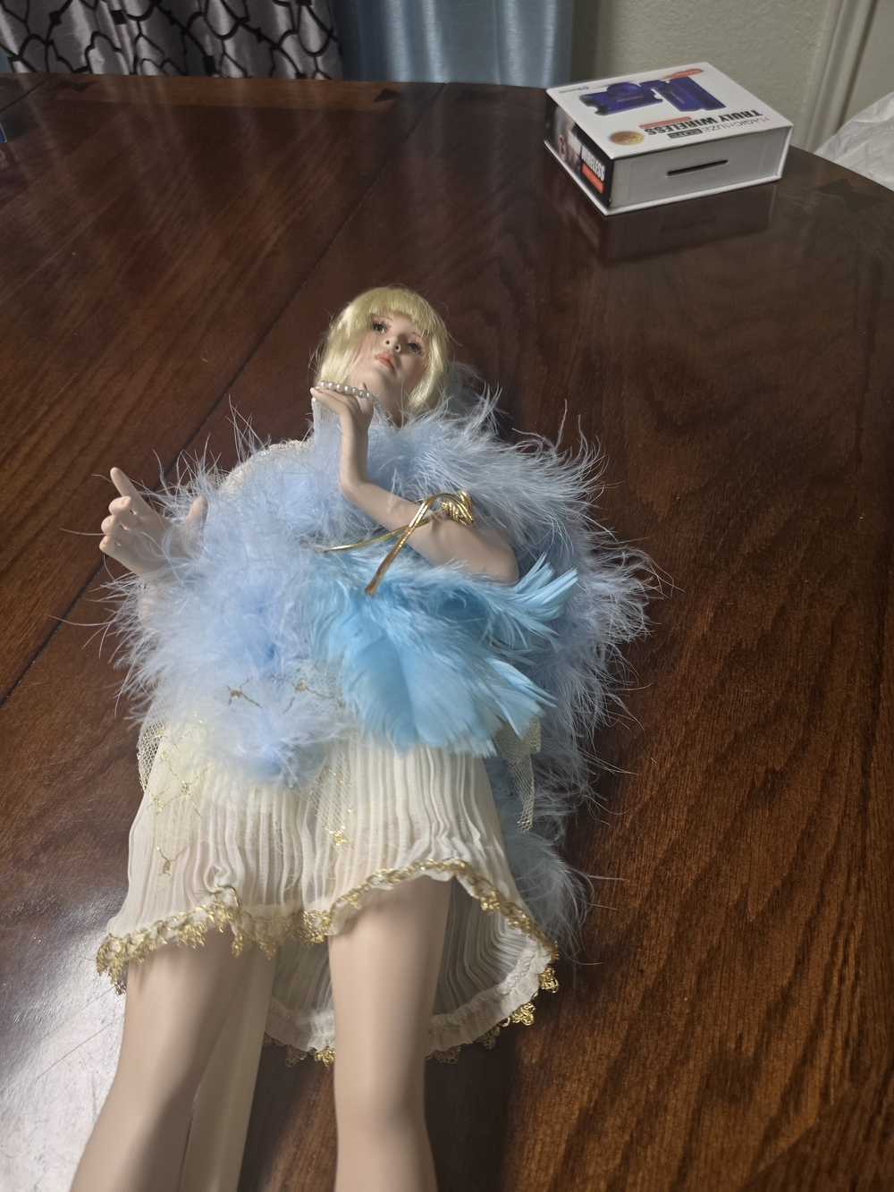 "Yvette," Elegant Feathered Porcelain Figurine - Light Blue